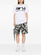 قمصان وقمصان بولو بيضاء من Comme des Garcons