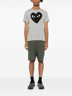 قمصان Comme des Garcons وقمصان بولو رمادية