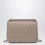 Valentino Garavani Medium Rockstud Spike bag in powder pink nappa leather