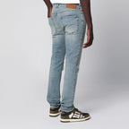 AMIRI MX1 distressed flannel-patched jeans in medium indigo