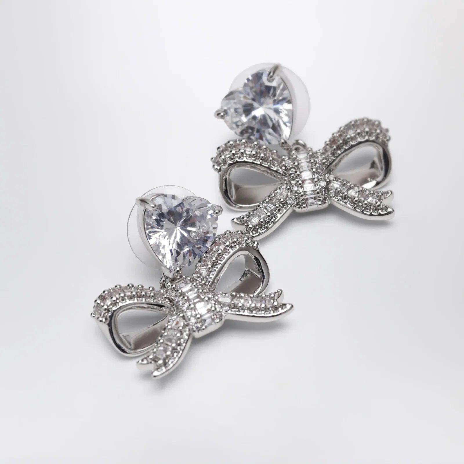 Self-Portrait Heart drop earrings with crystal bow in silver
