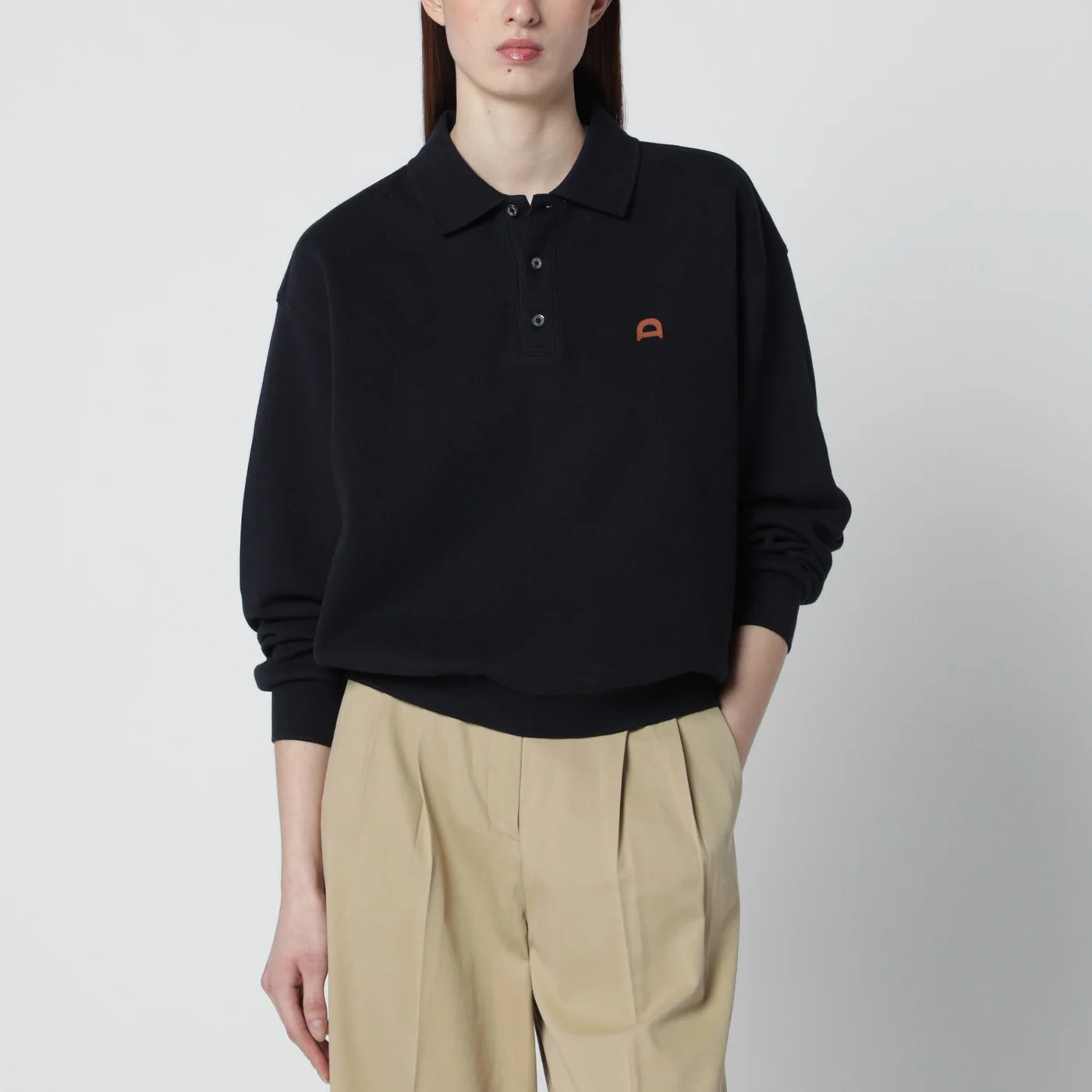 Dunst Navy blue polo shirt with leather logo